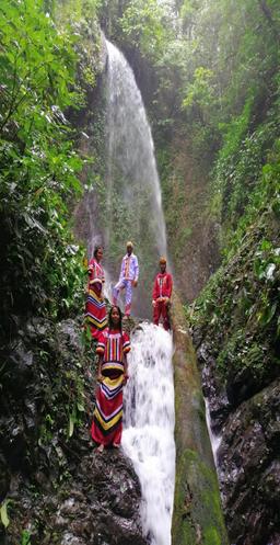 Community members at one of the Sacred Forest waterfalls