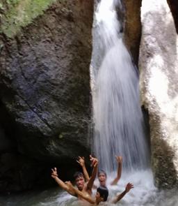 Community members at one of the Sacred Forest waterfalls